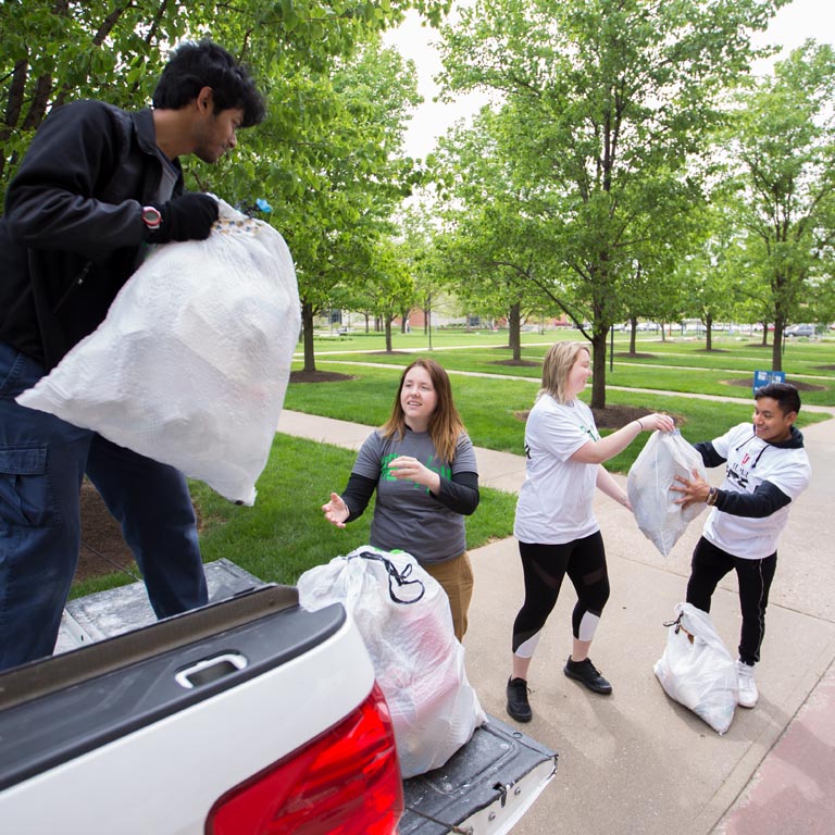 SPEA student volunteers collect trash.